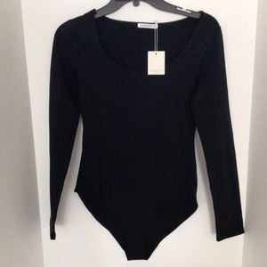 Womens round neck, long sleeve bodysuit.
